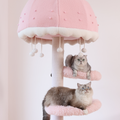 The cat tower is pink in color and has a dreamy design.