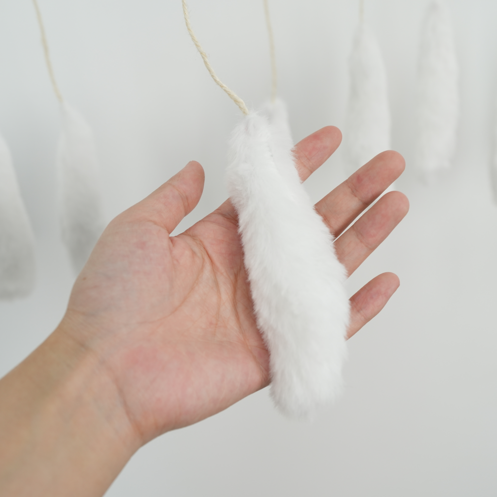 The cats' favorite little pom-pom balls