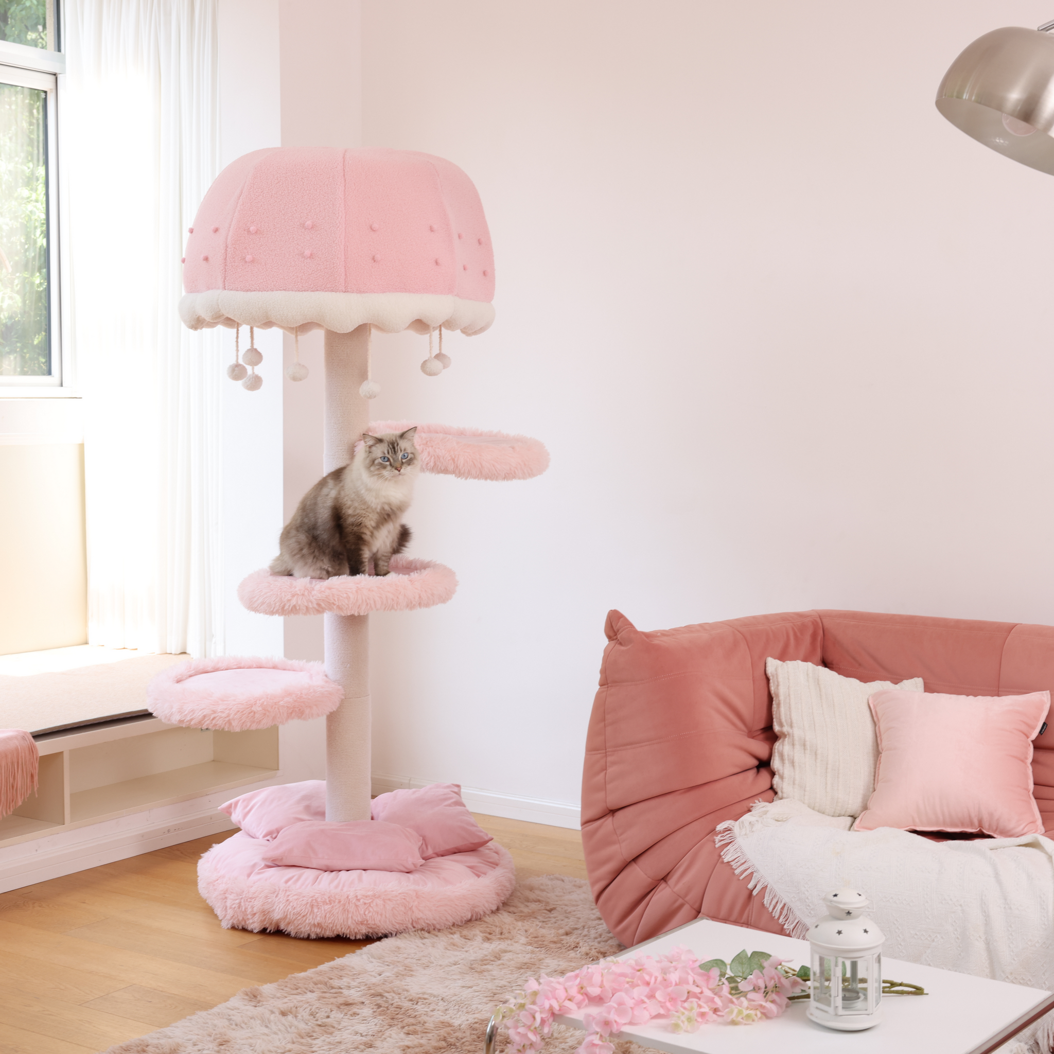 A pink cat tree styled as one of the most unique cat trees with a playful jellyfish shape.